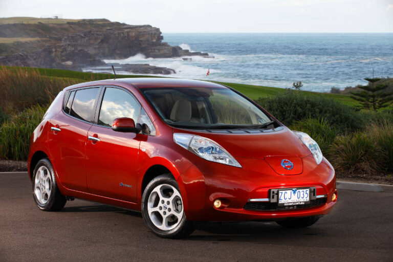 2017 red NISSAN LEAF on the beach in Victoria