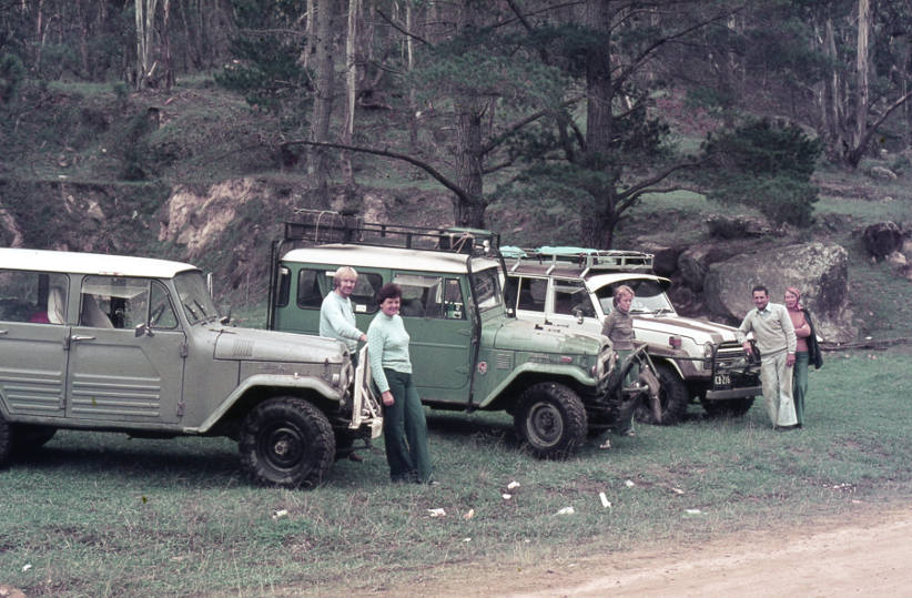 old Toyota Landcruiser in the bush with people