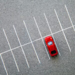 single red car in carpark