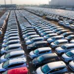 new vehicles lined up for delivery and sale