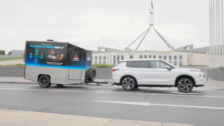 Mitsubishi PHEV and disaster releif trailer outside parliament house ACT