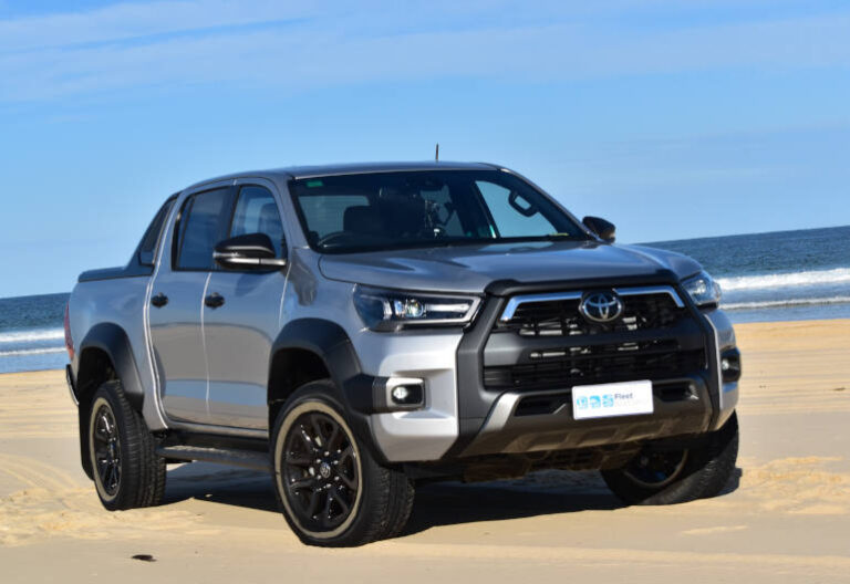 Hilux driving on the beach in Newcastle