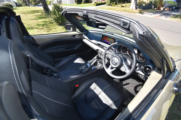 two seats in a. convertible sports car