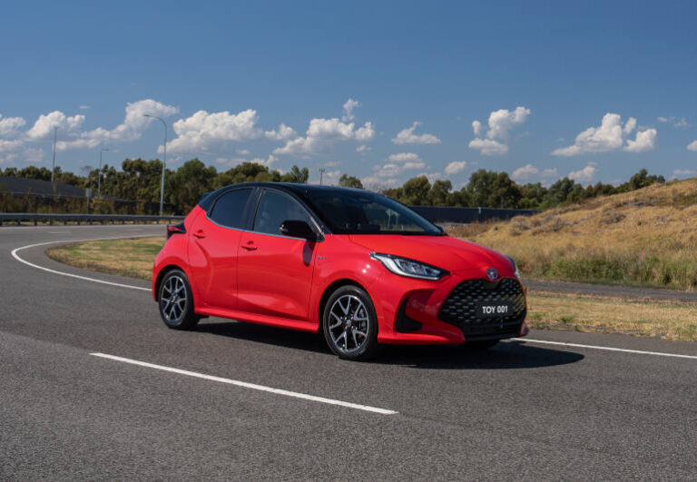 red Toyota Yaris hybrid