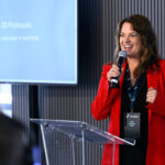 MELBOURNE, AUSTRALIA - MARCH 05: Carla Hoorweg, CEO ANCAP addresses the crowd during the HERE Technologies conference in the Chicane Pavilion at Albert Park Grand Prix Circuit on March 05, 2026 in Melbourne, Austra